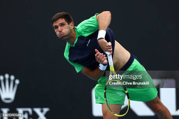 Federico Delbonis of Argentina serves in his first round singles match against Pedro Martinez of Spain during day one of the 2022 Australian Open at...