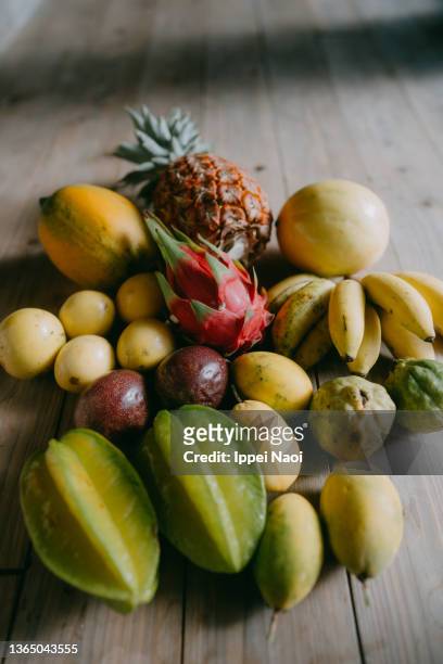 various local tropical fruits, ishigaki island, okinawa, japan - papaya stock-fotos und bilder
