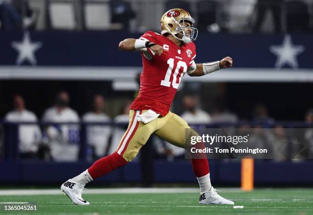 Jimmy Garoppolo of the San Francisco 49ers celebrates after a first down against the Dallas Cowboys during the fourth quarter in the NFC Wild Card...