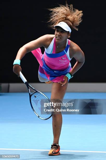 Naomi Osaka of Japan serves in her first round singles match against Camila Osorio of Colombia during day one of the 2022 Australian Open at...