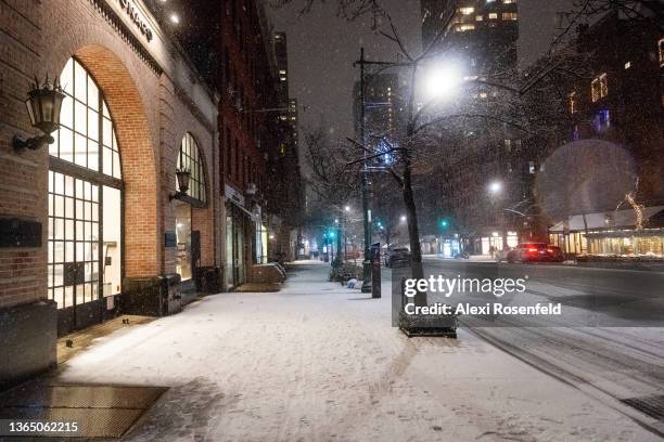 Street remains empty in snow during Winter Storm Izzy on January 16, 2022 in New York City. New York City cases have recently decreased despite a...