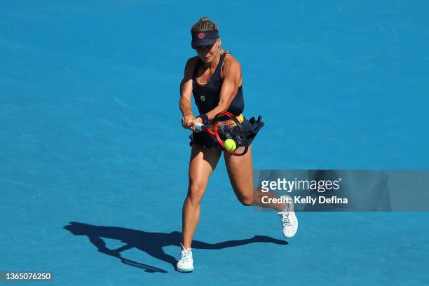 Irina Bara of Romania plays a backhand in her first round singles match against Nuria Parrizas Diaz of Spain during day one of the 2022 Australian...