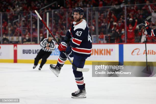 Washington Capitals right wing Tom Wilson celebrates a third period goal against the Vancouver Canucks at Capital One Arena on January 16, 2022 in...