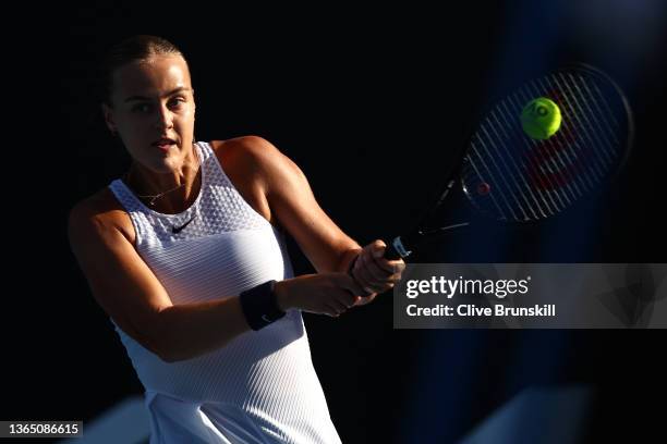 Anna Karolina Schmiedlova of Slovakia plays a backhand in his first round singles match against Jelena Ostapenko of Latvia during day one of the 2022...