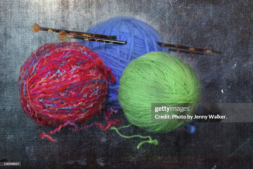 Balls of wools and pair of tortoise shell