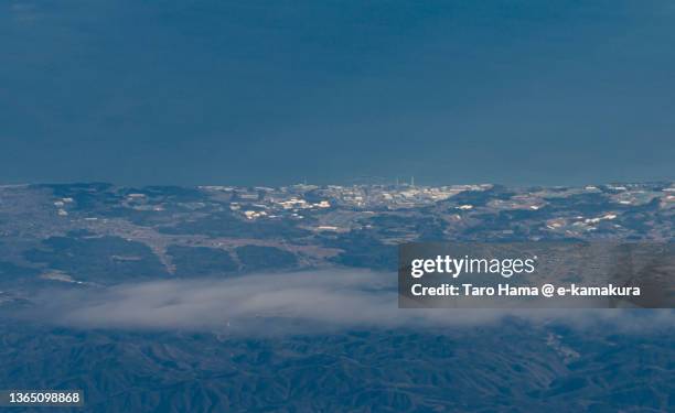 fukushima nuclear power plant in fukushima of japan aerial view from airplane - fukushima prefecture stock pictures, royalty-free photos & images