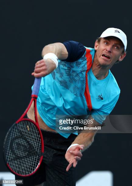 Kevin Anderson of South Africa serves in his first round singles match against Reilly Opelka of United States during day one of the 2022 Australian...