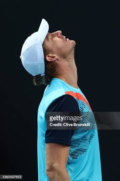 Kevin Anderson of South Africa reacts in his first round singles match against Reilly Opelka of United States during day one of the 2022 Australian...