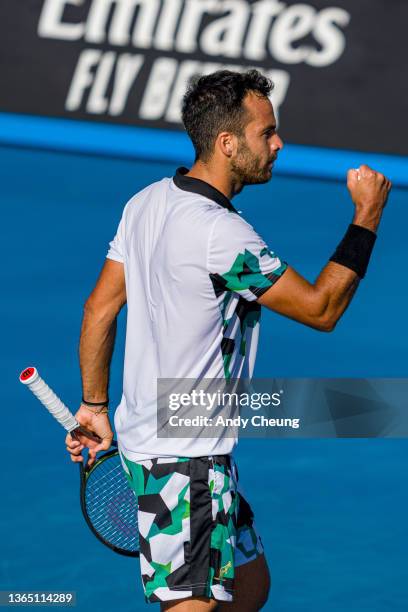 Salvatore Caruso of Italy celebrates winning a point in his first round singles match against SMiomir Kecmanovic of Serbia during day one of the 2022...