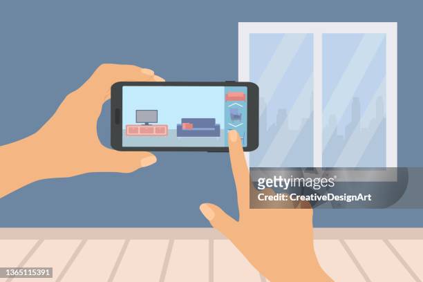 augmented reality concept. human hand holding smartphone with augmented reality application to place virtual furniture in real home. - home showcase interior stock illustrations