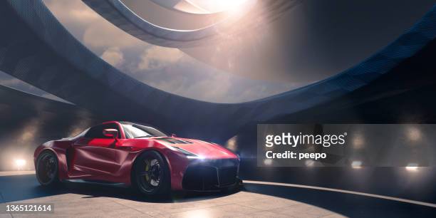 red electric sports car parked in futuristic building - luxury cars show stock pictures, royalty-free photos & images