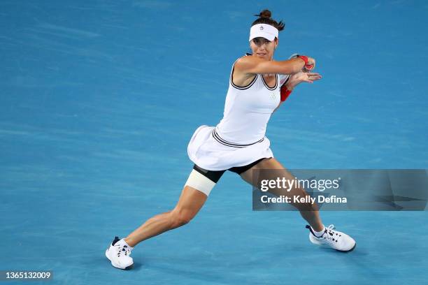 Ajla Tomljanovic of Australia plays a forehand in her first round singles match against Paula Badosa of Spain during day one of the 2022 Australian...