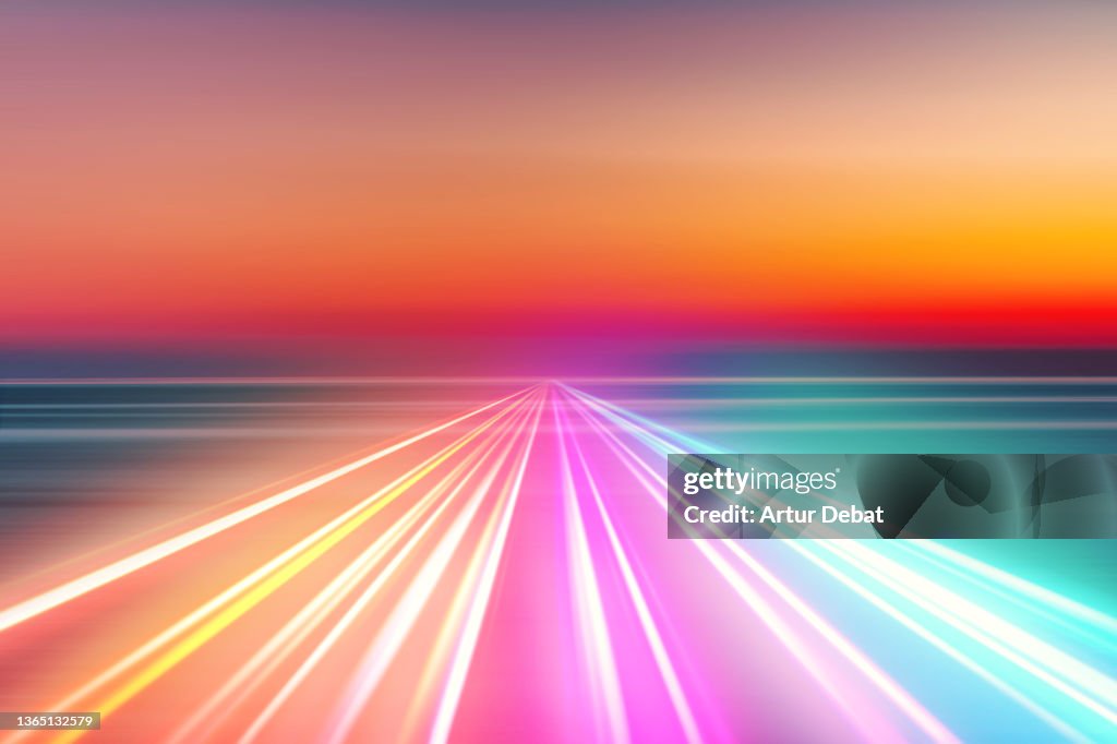 Abstract picture of colorful light trails crossing twilight sky with fast motion.
