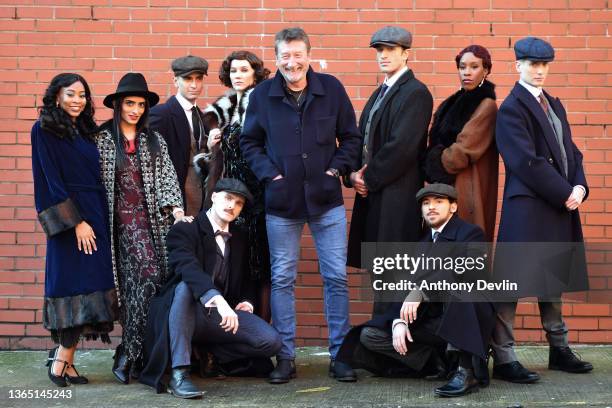 Steven Knight, creator of Peaky Blinders poses with dancers from Rambert during the press launch of a Rambert Dance production entitled "Peaky...