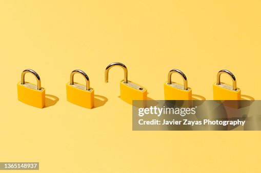 Five Yellow Padlocks On Yellow Background Five Yellow Padlocks On Yellow Background