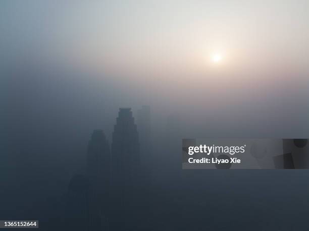 aerial view of city in strong mist - fog city stock pictures, royalty-free photos & images