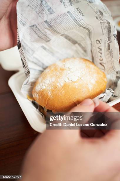 anonymous person preparing to eat burger - unwrapping burger stock pictures, royalty-free photos & images