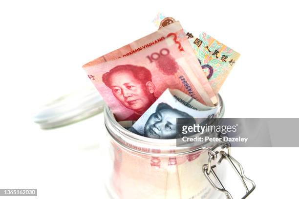 yuan bank notes in savings jar - 20 yuan note stock pictures, royalty-free photos & images