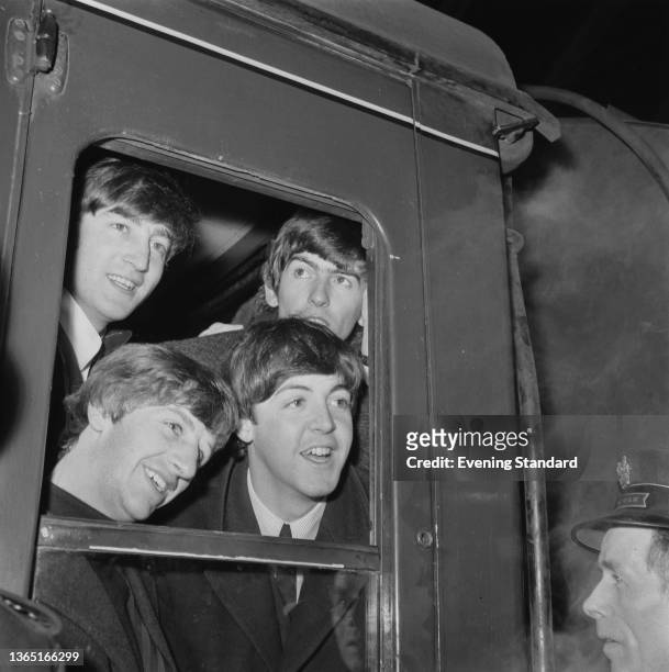 English rock group the Beatles at Paddington Station in London, UK, to catch the 8.30am train to Minehead for the filming of 'A Hard Day's Night',...