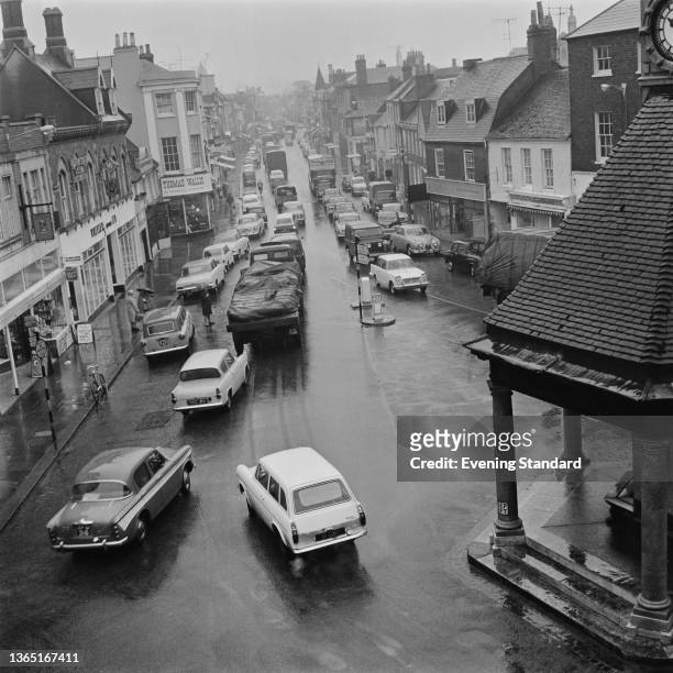 The town centre of Newbury in Berkshire, UK, looking south down the Broadway from Newbury clock tower, 19th March 1964.