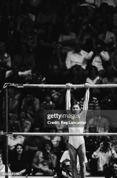 Romanian gymnast Nadia Comaneci wins a gold medal on the uneven bars at the 1976 Summer Olympics in Montreal, Canada, 26th July 1976.