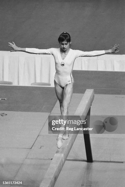 Romanian gymnast Nadia Comaneci wins a gold medal on the balance beam at the 1976 Summer Olympics in Montreal, Canada, 26th July 1976.