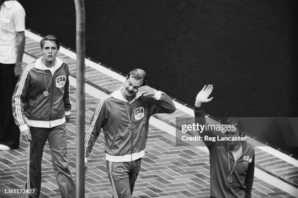 From left to right, US swimmers Peter Rocca and John Naber with their silver and gold medals for 100m backstroke, and Roland Matthes of East Germany...