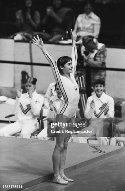 Romanian gymnast Nadia Comaneci wins a gold medal at the 1976 Summer Olympics in Montreal, Canada, 20th July 1976.