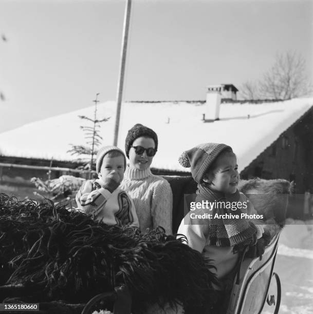 Princess Grace of Monaco on holiday in Gstaad, Switzerland, with her children Prince Albert and Princess Caroline, February 1962.