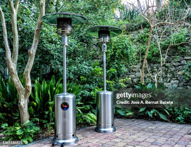 terrace gas heater on the street. - electric heater stock pictures, royalty-free photos & images