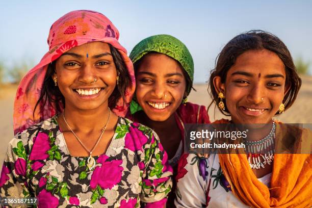 three happy gypsy indian girls, desert village, india - local gypsy stock pictures, royalty-free photos & images