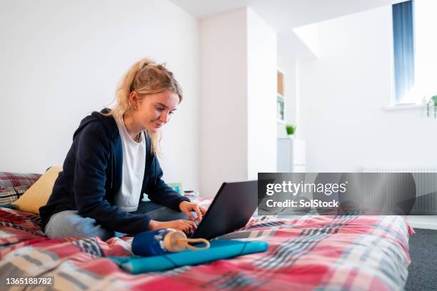 video calling into lecture - college dorm stock pictures, royalty-free photos & images