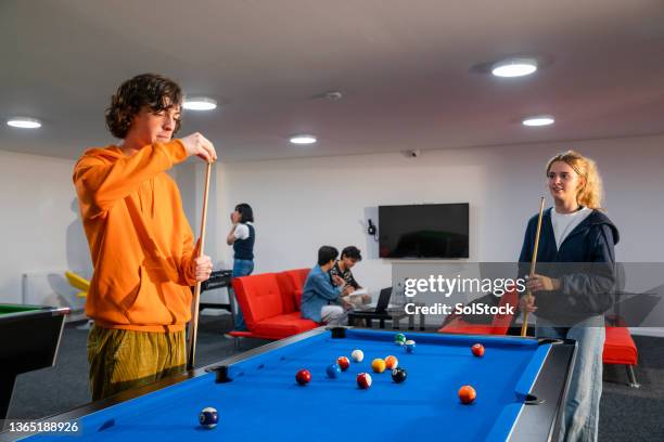 having a friendly game of pool - sunderland university stock pictures, royalty-free photos & images