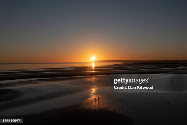 The sun sets over Camber Sands on January 17, 2022 in Camber, United Kingdom.