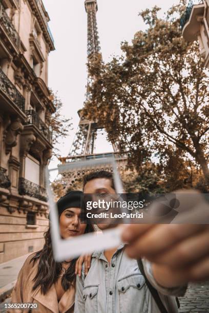 couple having a romantic vacation in paris - the two towers stock pictures, royalty-free photos & images