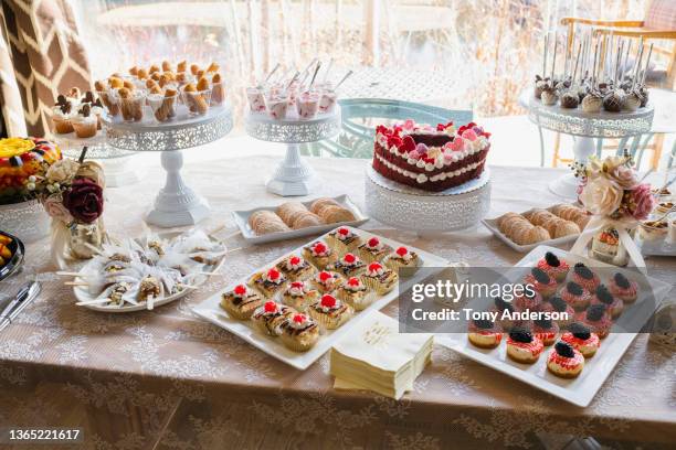 pastries on buffet table - buffet stockfoto's en -beelden