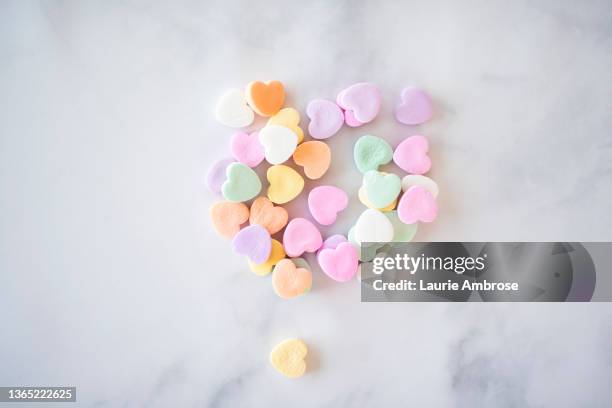 valentine's day conversation hearts - candy heart stock pictures, royalty-free photos & images