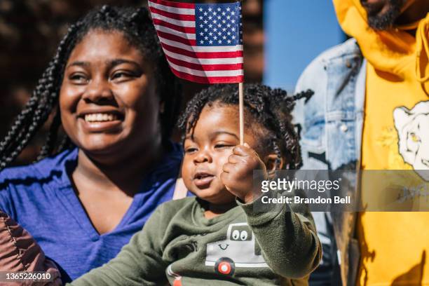 The Brannigan family bond together during the 28th Annual Martin Luther King Jr. Grande Parade on January 17, 2022 in Houston, Texas. Community...
