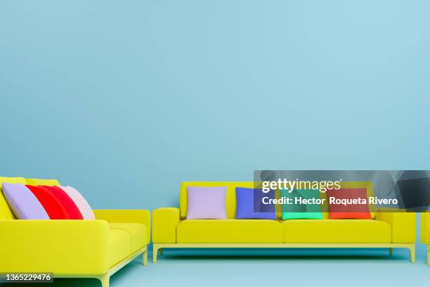 3d computer generated image of three yellow sofas with colorful cushions on blue walls, minimalist interior concept - hector vivas fotografías e imágenes de stock