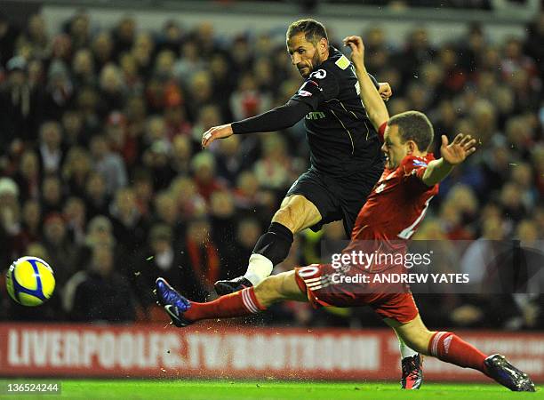 Oldham Athletic's Finnish forward Shefki Kuqi shoots during the FA Cup football match between Liverpool and Oldham Athletic at Anfield, Liverpool,...