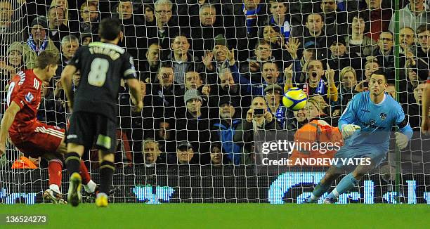 Liverpool's English midfielder Steven Gerrard scores from a penalty during the FA Cup football match between Liverpool and Oldham Athletic at...