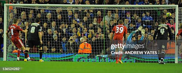 Liverpool's English midfielder Steven Gerrard scores from a penalty during the FA Cup football match between Liverpool and Oldham Athletic at...
