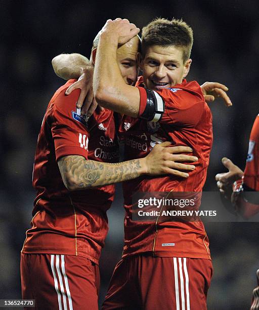 Liverpool's English midfielder Jonjo Shelvey celebrates with his teammate English midfielder Steven Gerrard after scoring during the FA Cup football...