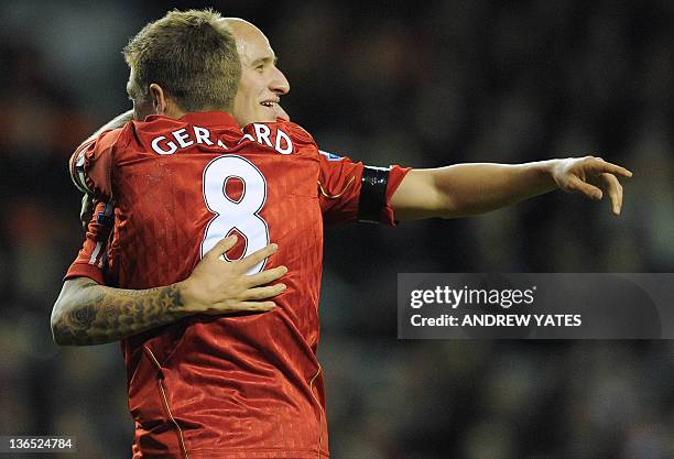 Liverpool's English midfielder Jonjo Shelvey celebrates with his teammate English midfielder Steven Gerrard after scoring during the FA Cup football...