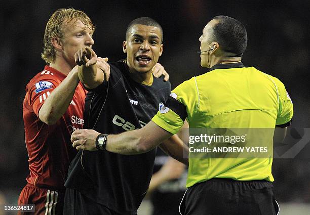 Oldham Athletic's English midfielder Tom Adeyemi reacts after hearing a supporter shouting towards him during the FA Cup football match between...