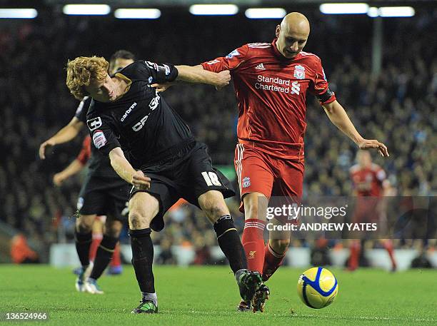 Liverpool's English midfielder Jonjo Shelvey vies with Oldham Athletic's English midfielder Chris Taylor during the FA Cup football match between...