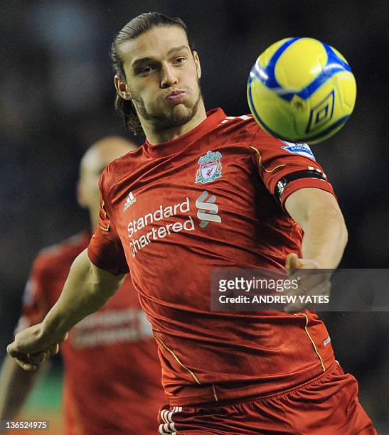 Liverpool's English forward Andy Carroll eyes the ball during the FA Cup football match between Liverpool and Oldham Athletic at Anfield in...