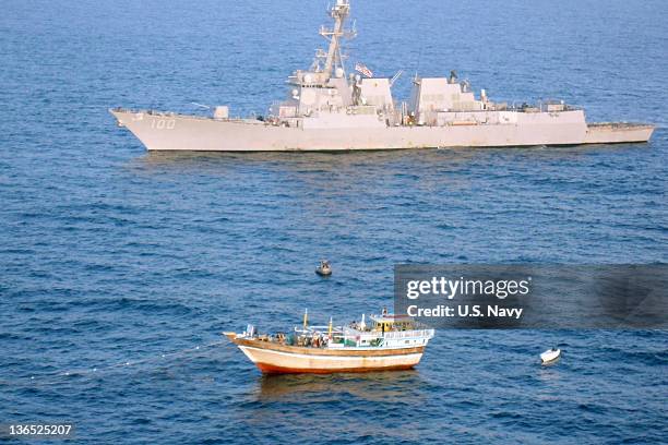 In this handout provided by the U.S. Navy, the guided-missile destroyer USS Kidd responds to a distress call from the Iranian fishing vessel Al Molai...