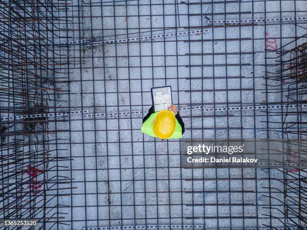 aerial view of construction site foundations, engineer working. - building foundations stockfoto's en -beelden