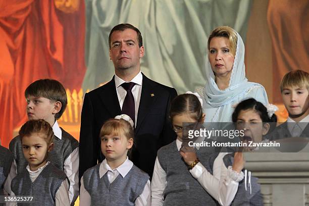 Russian President Dmitry Medvedev and his wife Svetlana Medvedeva attend Christmas Mass in the Cathedral of Christ the Saviour on January 6, 2012 in...